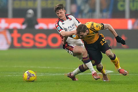 Serie A, Inter Milan and Genoa: Inter Milan's Nicolo Barella challenges for the ball with Genoa's Morten Frendrup