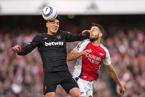 EPL Arsenal vs West Ham: West Ham's Edson Alvarez challenges for the ball with Arsenal's Mikel Merino