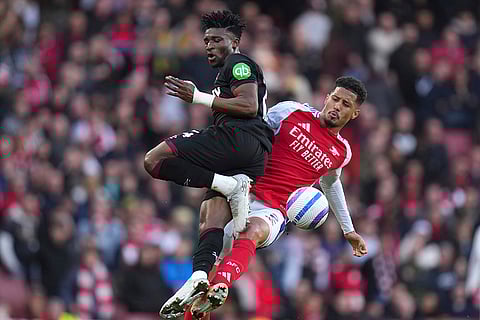 EPL Arsenal vs West Ham: Arsenal's William Saliba challenges for the ball with West Ham's Mohammed Kudus