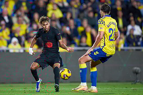 La Liga 2024-25: Barcelona's Lamine Yamal duels for the ball with Las Palmas' Alex Munoz