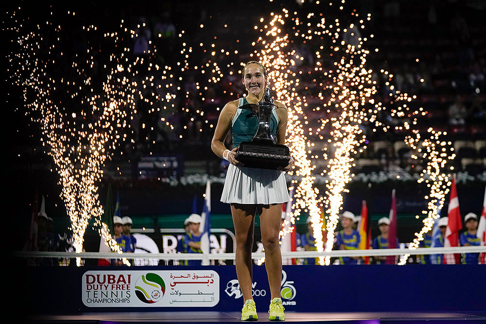 | Photo: AP/Altaf Qadri : Dubai Duty-Free Tennis Championship: Russia's Mirra Andreeva holds the winner's trophy