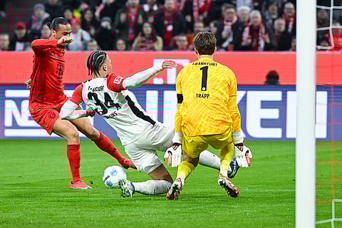 Bundesliga 2024-25, Bayern vs Eintracht: Leroy Sane of Munich in action with Frankfurt's Nnamdi Collins and Kevin Trapp