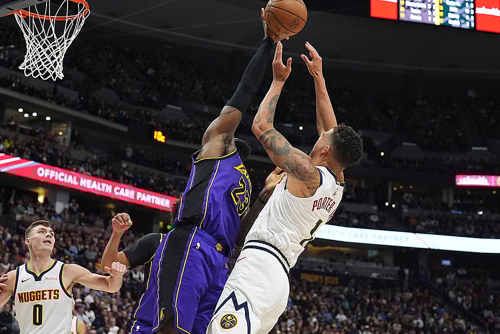 | Photo: AP/David Zalubowski : NBA 2024-25, Lakers vs Nuggets: Lakers forward LeBron James blocks a shot by Nuggets forward Michael Porter Jr. 
