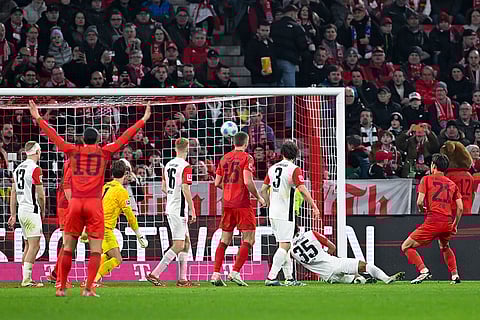 Bundesliga 2024-25, Bayern vs Eintracht: Hiroki Ito of Munich, right, scores