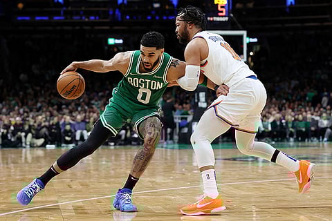 NBA 2024-25, Knicks vs Celtics: Celtics' Jayson Tatum (0) looks to move past Knicks' Jalen Brunson