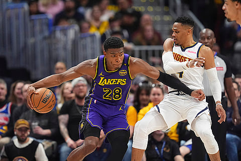 NBA 2024-25, Lakers vs Nuggets: Lakers forward Rui Hachimura, left, drives to the basket
