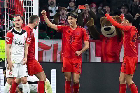 Bundesliga 2024-25, Bayern vs Eintracht: Munich's Hiroki Ito, center, celebrates scoring