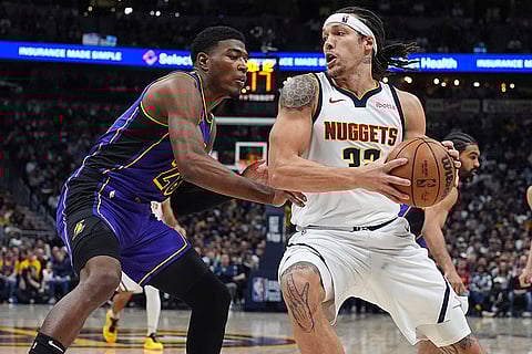 NBA 2024-25, Lakers vs Nuggets: Nuggets forward Aaron Gordon, right, drives to the basket