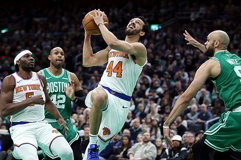 NBA 2024-25, Knicks vs Celtics: Knicks' Landry Shamet (44) shoots against Celtics' Derrick White