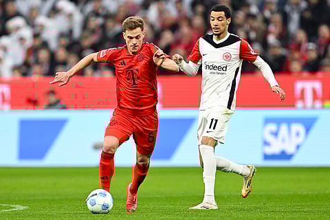 Bundesliga 2024-25, Bayern vs Eintracht: Munich's Joshua Kimmich, left, and Frankfurt's Hugo Ekitike in action