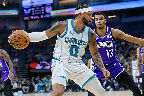 NBA 2024-25: Hornets forward Miles Bridges (0) is guarded by Kings forward Keegan Murray