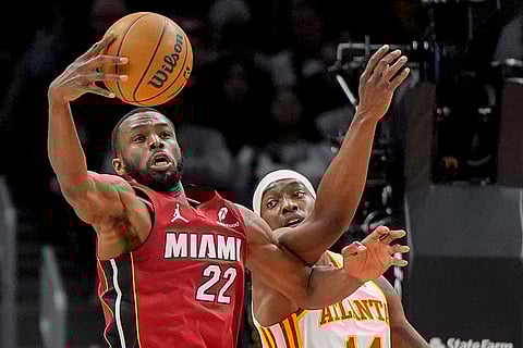 NBA 2024-25: Heat forward Andrew Wiggins (22) tries to shoots against Miami Heat 
