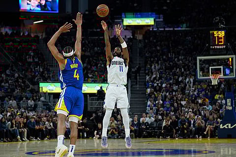 NBA 2024-25, Mavericks vs Warriors: Mavericks guard Kyrie Irving (11) shoots a 3-point basket