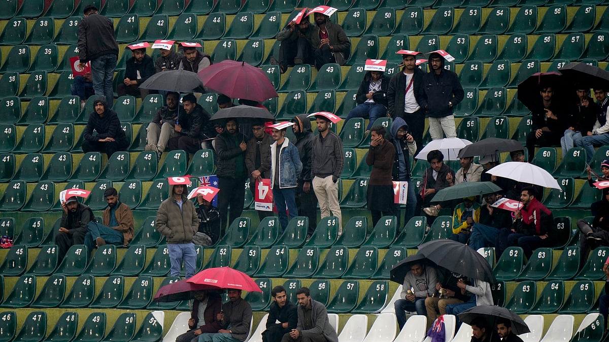  (AP Photo/Anjum Naveed)

 : Fans wait as rain delayed the ICC Champions Trophy cricket match between Australia and South Africa, in Rawalpindi, Pakistan Tuesday, Feb. 25, 2025.

