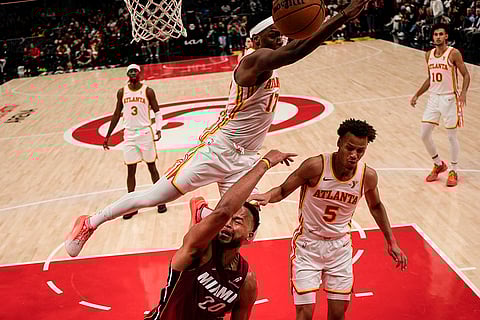 NBA 2024-25: Hawks forward Onyeka Okongwu (17) works for the ball 