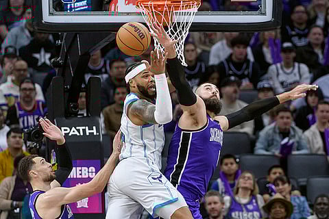 NBA 2024-25: Hornets forward Miles Bridges and Kings center Jonas Valanciunas battle for a rebound