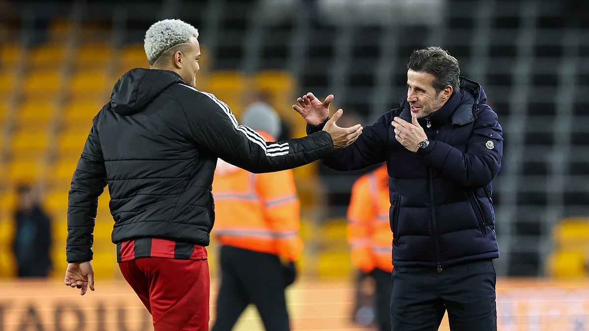 Rodrigo Muniz and Marco Silva celebrate together as Fulham beat Wolves 2-1 at Molineux.