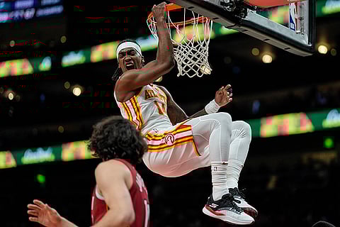 NBA 2024-25: Hawks guard Terance Mann (14) dunks the ball
