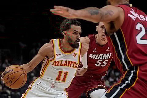 NBA 2024-25: Hawks guard Trae Young drives against Miami Heat