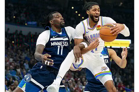 NBA 2024-25, Timberwolves vs Thunder: Thunder guard Isaiah Joe, front right, grabs a rebound