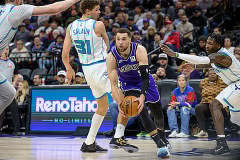 NBA 2024-25: Kings guard Zach LaVine drives past Hornets forward Tidjane Salaun