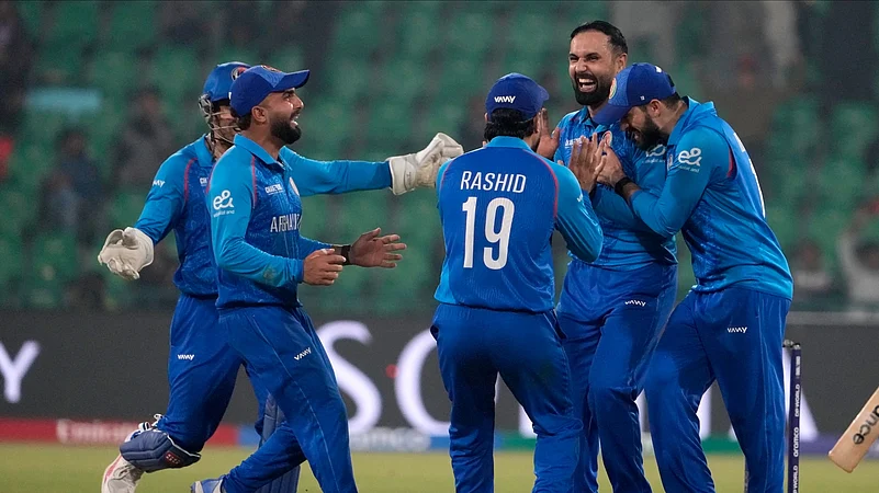 Afghanistans Mohammad Nabi, second right, celebrates. AP Photo