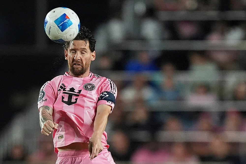 | Photo: AP/Rebecca Blackwell : CONCACAF Champions Cup: Inter Miami forward Lionel Messi heads the ball