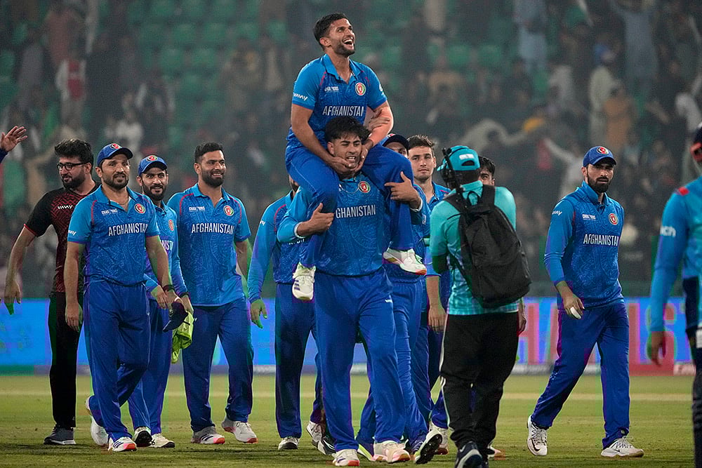| Photo: AP/K.M. Chaudary : ICC Champions Trophy, AFG vs ENG: Afghanistan's players celebrate after winning the match