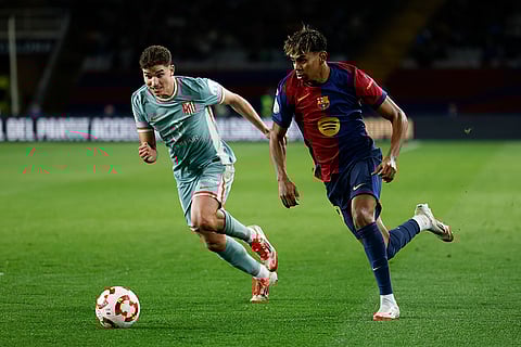 Copa Del Rey SFs: Atletico Madrid's Julian Alvarez and Barcelona's Lamine Yamal fight for the ball