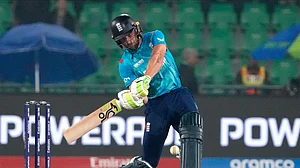 AP Photo/K.M. Chaudary : England's Jos Buttler plays a shot during the ICC Champions Trophy cricket match between Afghanistan and England, in Lahore, Pakistan.