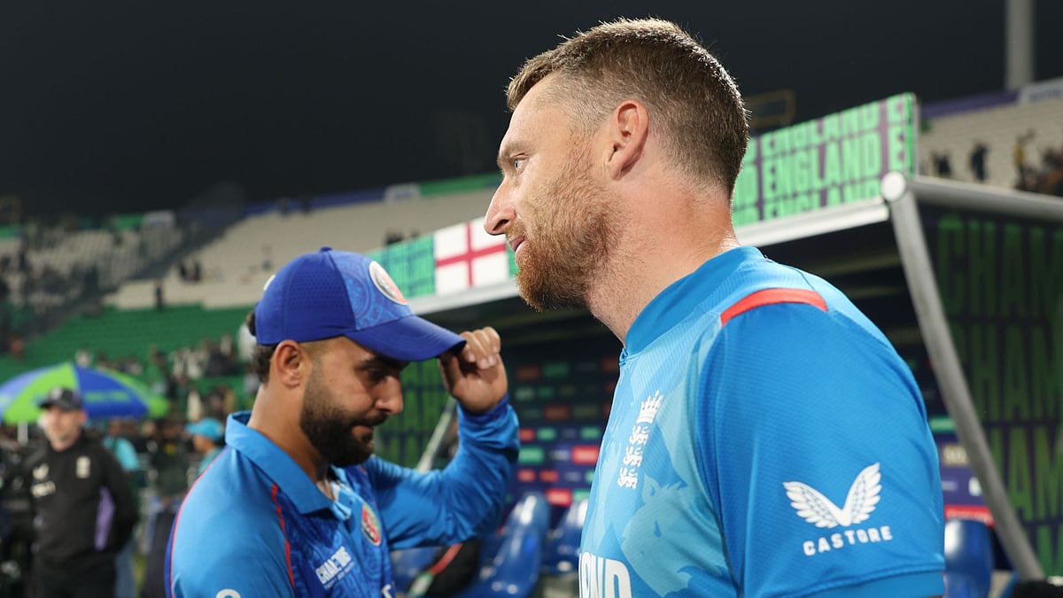 Buttler looks on after England's elimination was confirmed - null