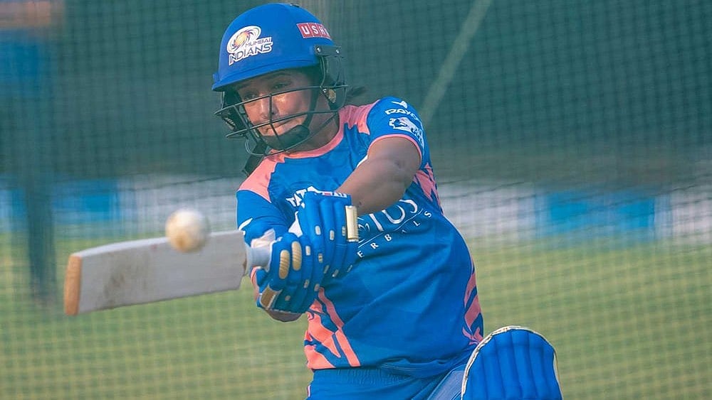 | Photo Courtesy: Mumbai Indians : Mumbai Indians captain Harmanpreet Kaur takes to the nets ahead of the WPL 2025 season