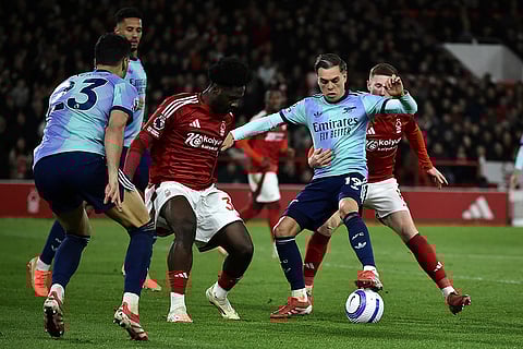 EPL 2024-25: Nottingham Forest's Elliot Anderson Nottingham Forest's Ola Aina fight for the ball