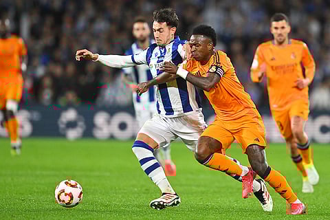 Copa del Rey, RSO vs RMA: Real Sociedad's Martin Zubimendi challenges for the ball with Real Madrid's Vinicius Junior