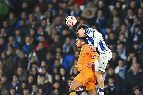 Copa del Rey, RSO vs RMA: Real Madrid's Jude Bellingham challenges for the ball with Real Sociedad's Jon Aramburu