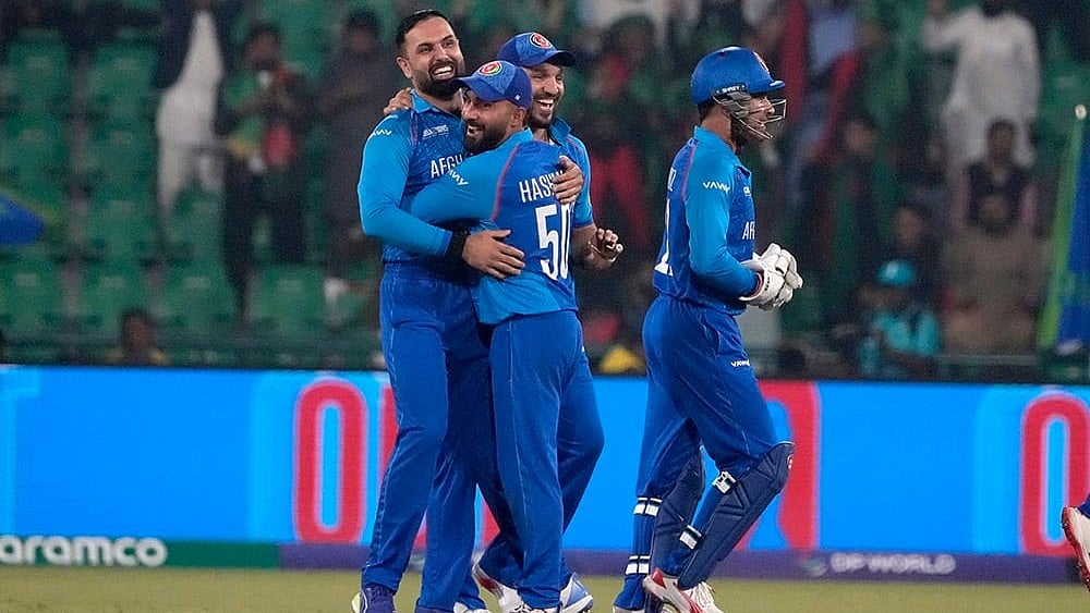 | Photo: AP/K.M. Chaudary : ICC Champions Trophy, AFG vs ENG: Afghanistan's Mohammad Nabi celebrates after taking the wicket of England's Jamie Smith