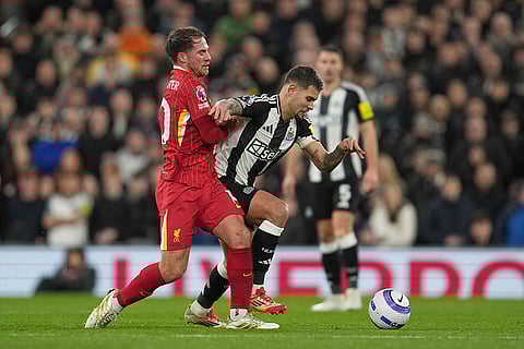 EPL 2024-25: Newcastle's Bruno Guimaraes is challenged by Liverpool's Alexis Mac Allister