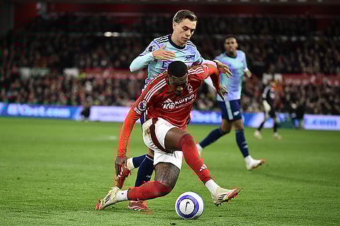 EPL 2024-25: Nottingham Forest's Callum Hudson-Odoi and Arsenal's Leandro Trossard fight for the ball