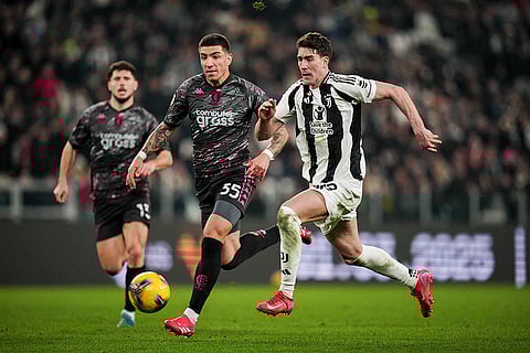 Coppa Italia Quarter-final: Empoli's Luca Marianucci and Juventus' Dusan Vlahovic battle for the ball