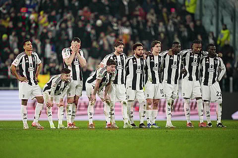 Coppa Italia Quarter-final: Juventus players look on during a penalty shootout