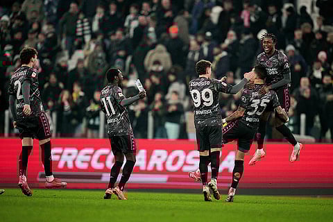Coppa Italia Quarter-final: Empoli's Luca Marianucci celebrates after scoring the winning kick