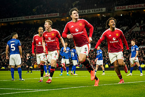 EPL 2024-25: Manchester United's Harry Maguire celebrates with teammates after scoring a goal