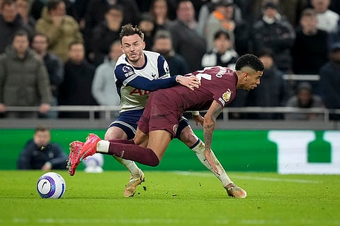EPL 2024-25: Tottenham's James Maddison fouls Manchester City's Savinho