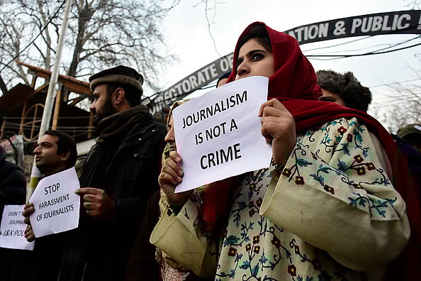 Getty images : Kashmiri journalists hold placards during a protest against the high handedness of armed forces in Srinagar on 18 December 2019 |