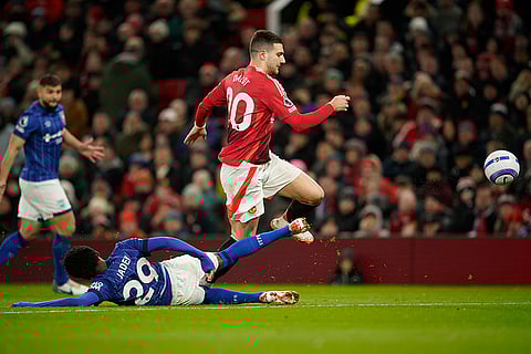 EPL 2024-25: Manchester United's Diogo Dalot duels for the ball with Ipswich Town's Jaden Philogene