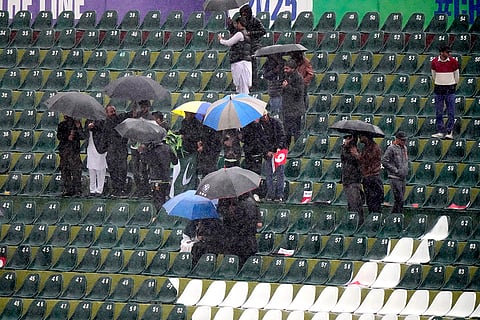ICC Champions Trophy, PAK vs BAN: Fans hold umbrellas during rain