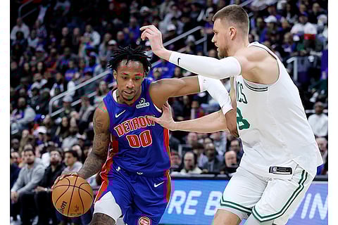 NBA 2024-25: Pistons forward Ronald Holland II (00) drives to the basket