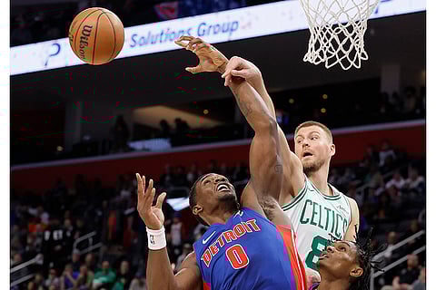 NBA 2024-25: Celtics center Kristaps Porzingis (8) passes the ball