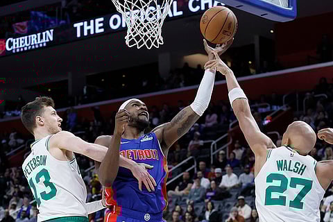 NBA 2024-25: Pistons forward Paul Reed is guarded by Celtics forward Drew Peterson