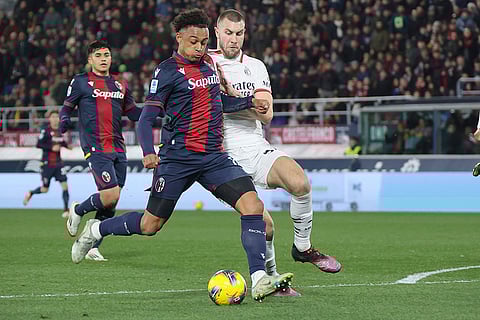Serie A 2024-25: Bologna's Dan Ndoye and Milan's Strahinja Pavlovic in action